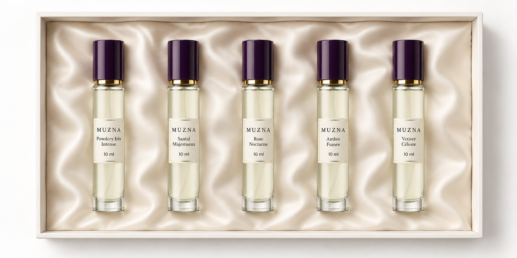 Five slim 10 ml Muzna sample bottles on an ivory silk cushion inside a discovery box